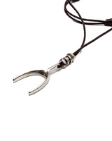 Metallic necklace with a unique design on a white background