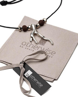 Necklace with antler-like pendant on a branded card, with 'otherwise' branding visible.