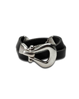 Black leather bracelet with a silver clasp on a white background
