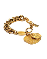 Gold chain bracelet with heart and round pendants on a white background