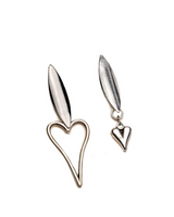 Pair of silver heart-shaped earrings on a white background