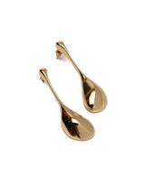 Gold teardrop-shaped earrings on a white background