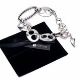 Chunky silver plated anchor link necklace and bracelet set with carabiner closure, on a black suede pouch.