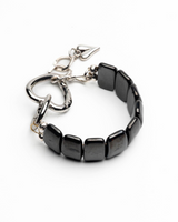 Black beaded bracelet with silver clasp on a white background