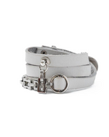 White leather bracelet with silver chain and clasp on a white background