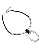 Chunky black leather choker with a large silver geometric circle pendant, featuring an adjustable chain.