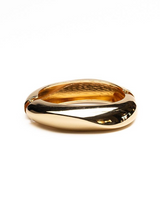 Chunky gold cuff bangle with a smooth, high-polish finish featuring a twisted design for an elegant look.