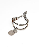 Equestrian Leather Bracelet featuring brown leather wrap and oversized silver-plated horse bit link, with coin pendants.