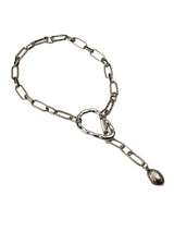 A silver-toned chain necklace with a distinctive Y-shaped clasp and a dangling teardrop-shaped charm, shown on a plain white background.