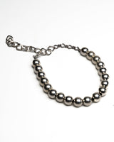 Chunky silver ball chain choker with adjustable extension, showcasing a bold sculptural design and polished finish.