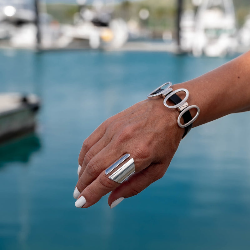 Black leather cuff bracelet with metal oval elements (BR-482)
