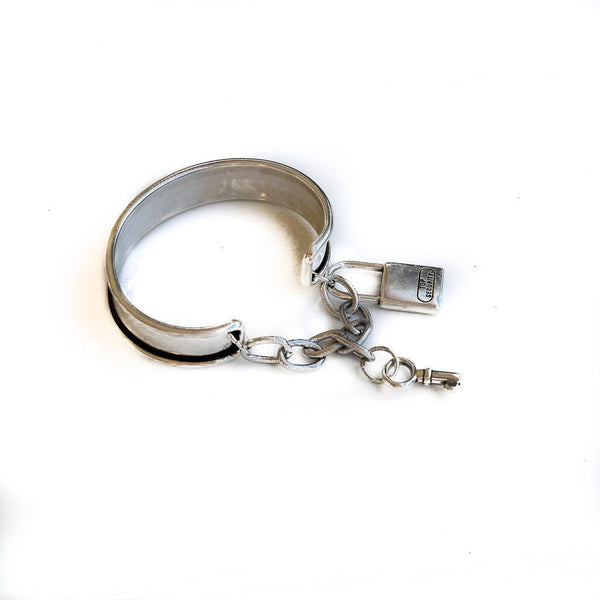 Vintage aged cuff bracelet with key and padlock, antique matt silver bangle with charms