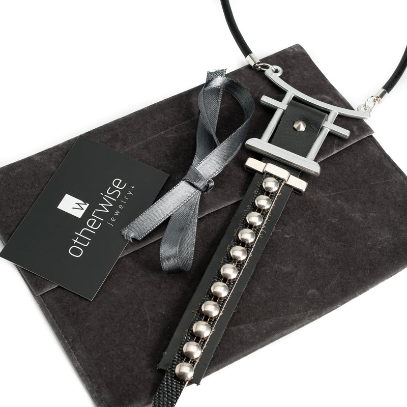 Rock style chocker necklace made of a sturdy metal design and black leather with studs