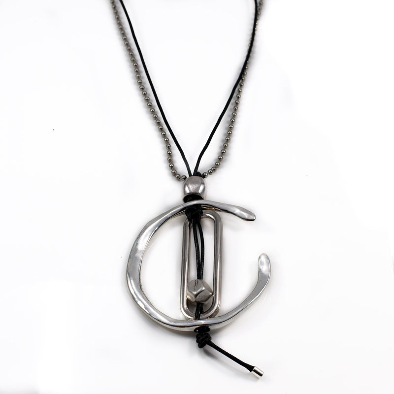Necklace with unique asymmetrical metal design, created in the Uno de 50 style