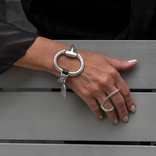 Unode50 style bracelet, Standout black leather and horsebit metal, Equestrian cuff bracelet