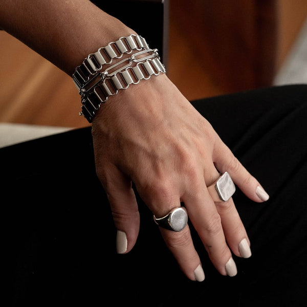 Layered statement chain bracelets and bangle, Stacked chunky stainless steel bracelets and hammered bangle.