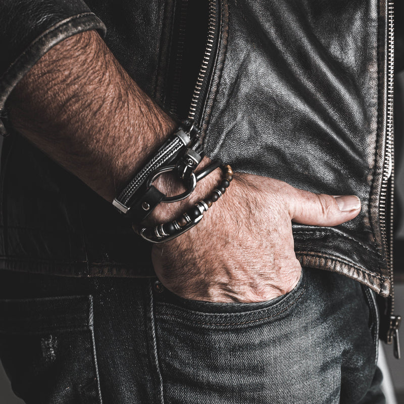 Wrap bracelet with black leather, iron chains and metal elements