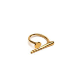 A modern gold or silver statement ring, an edgy-chic stainless steel ring, asymmetrical minimalistic art worn on your finger