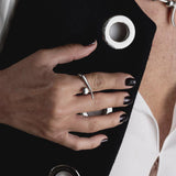 A modern gold or silver statement ring, an edgy-chic stainless steel ring, asymmetrical minimalistic art worn on your finger