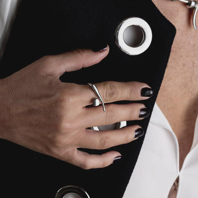 A modern gold statement ring, an edgy-chic stainless steel ring, asymmetrical minimalistic art worn on your finger