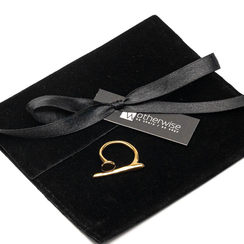 A modern gold statement ring, an edgy-chic stainless steel ring, asymmetrical minimalistic art worn on your finger