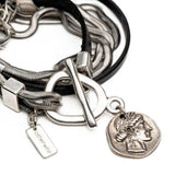 Double wrap bracelet with multiple snake chains, leather and unique buckle with coin pendant for a statement look
