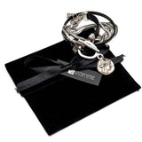 Double wrap bracelet with multiple snake chains, leather and unique buckle with coin pendant for a statement look