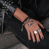 Edgy black and silver wrap bracelet with shackle detail, anchor chain, and chunky gothic punk chain design
