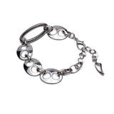 Silver necklace with chain and circular links on a white background