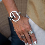 Standout black leather and horsebit metal, Equestrian cuff bracelet, Unode50 style bracelet, Chunky brutalist jewelry