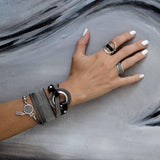 Bold textured disc bracelet with leather and strass, rock style statement bracelet for a strong look