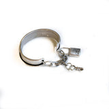 Vintage aged cuff bracelet with key and padlock, antique matt silver bangle with charms
