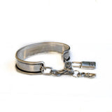 Vintage aged cuff bracelet with key and padlock, antique matt silver bangle with charms