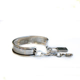 Vintage aged cuff bracelet with key and padlock, antique matt silver bangle with charms