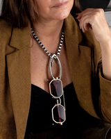 Chunky stainless steel box chain necklace with oversized silver carabiner clasp, styled with trendy sunglasses.