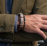 Men’s bracelet with flat silver chain on tan leather