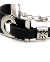 Chunky black leather bracelet featuring silver-plated metal accents and an adjustable chain. Edgy rock style design.