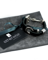 Chunky black leather bracelet with silver-plated accents, featuring an adjustable extension chain.