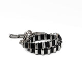 Edgy stainless steel bracelet with black leather in chain and oversized buckle, chunky wrap rocker cuff