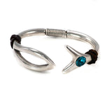 Silver Swarovski open cuff bracelet with Indicolite crystal, dark brown leather details, and chunky fish-shaped design