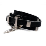 Edgy wrap-around black leather bracelet with silver-plated designs