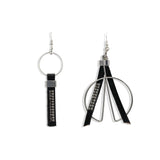 Funky earrings made of black leather with strass and silver-plated elements, different earring on each ear worn together or individually