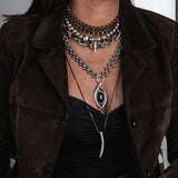 Layered gold, silver and different textured chokers and necklaces for a statement look!