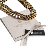 Layered gold, silver and different textured chokers and necklaces for a statement look!
