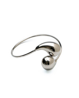 Unique arm wrist bracelet featuring a sleek silver cuff with large stainless steel drops for a bold, stylish look.