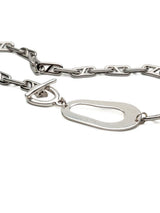 Chunky stainless steel anchor chain necklace with an abstract irregular metal pendant and a T-bar toggle clasp.