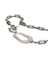 Chunky stainless steel necklace with an irregular metal pendant and T-bar clasp, featuring a bold anchor chain design.