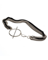 Triple Chain Necklace featuring two stainless steel snake chains and a black aluminum chain, with a large T-clasp.