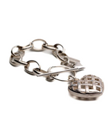 Textured heart charm bracelet in antique-plated 999 silver with a woven heart pendant and linked chain design.