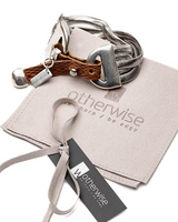 Bold snake chains and woven leather cuff bracelet featuring a rich brown leather strap and shiny metallic elements.